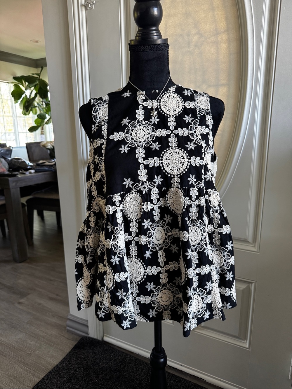 Commense Black Sleeveless Peplum Top with Cream Floral Lace Print